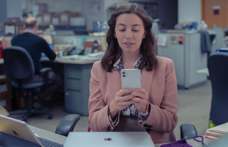 a lady looking at her iphone