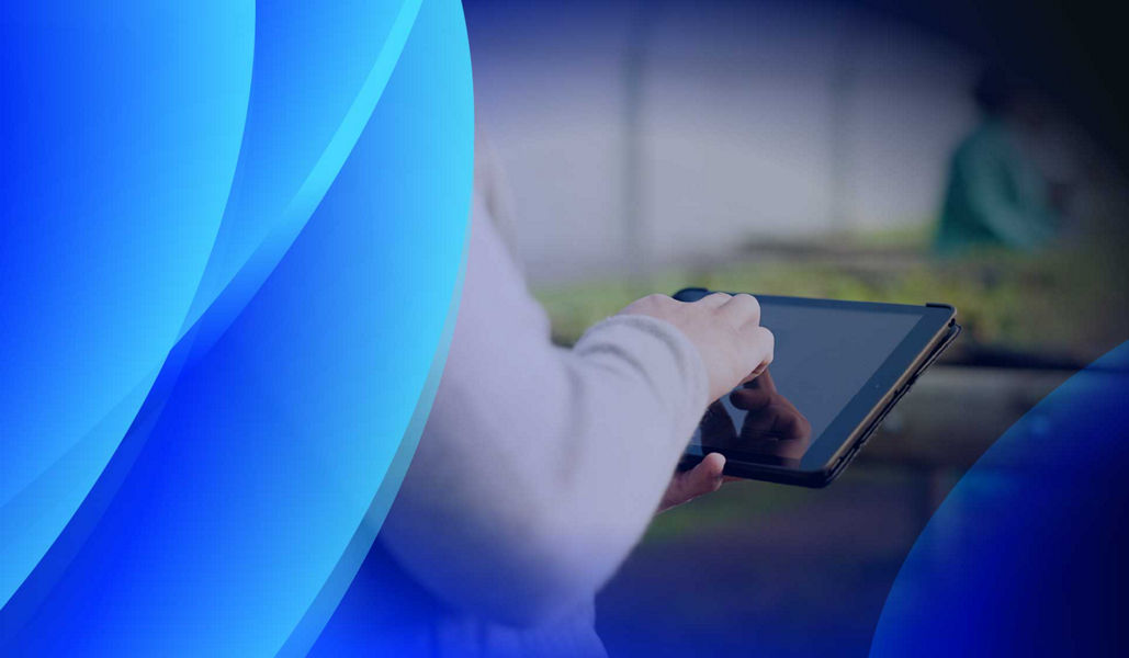 A person using a tablet to manage their supply chain