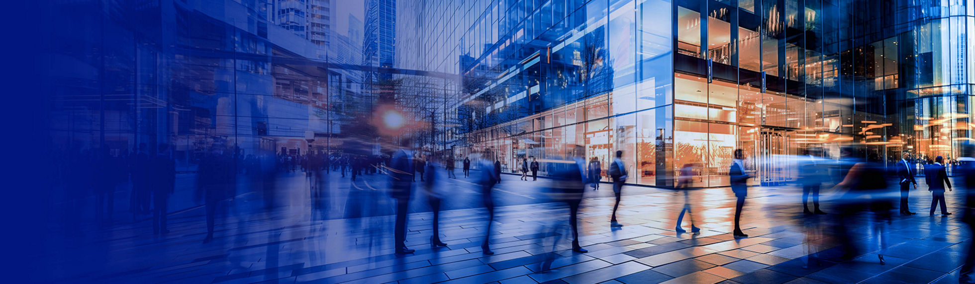 A busy city scene of people walking around