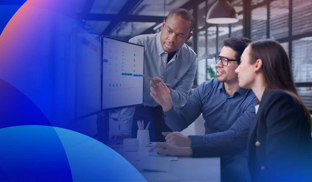 Team collaborating on AI-enhanced insight and analytics using digital dashboards.