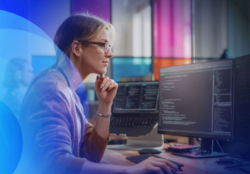 A female professional using a computer with code