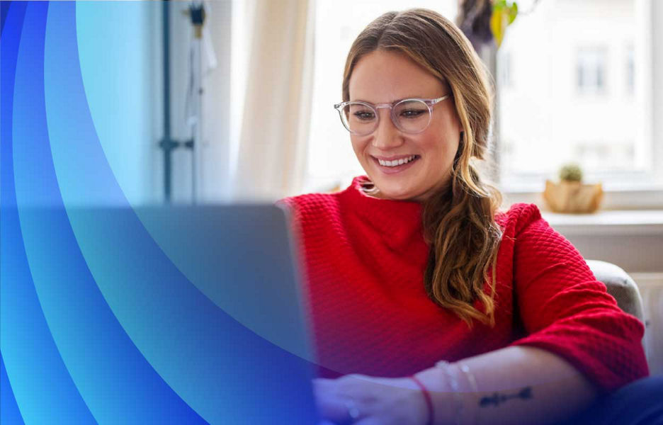 Woman smiling while on laptop