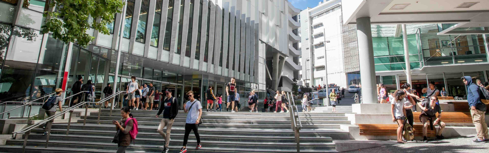 Landscape of a busy AUT City Campus with people strolling around campus.