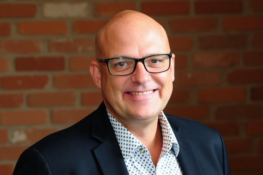 Cropped portrait of Datacom’s Director of Cybersecurity Consulting, Adam Kirkpatrick, smiling