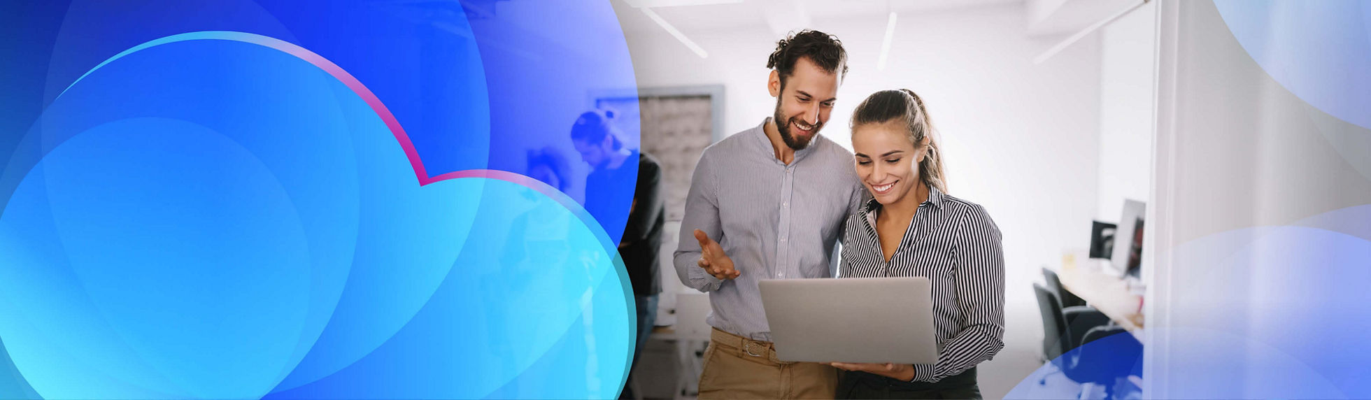 Two smiling cloud team members having a discussion