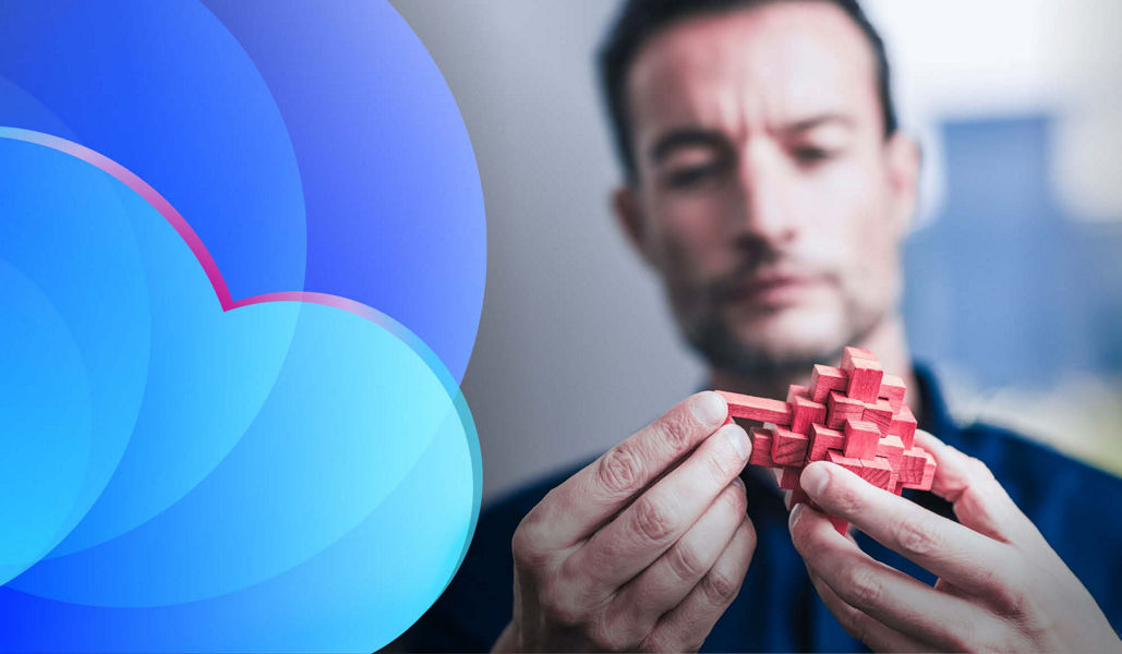 A man holding a block puzzle