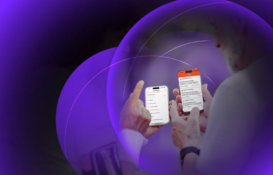 Two elderly individuals looking at their phone screens
