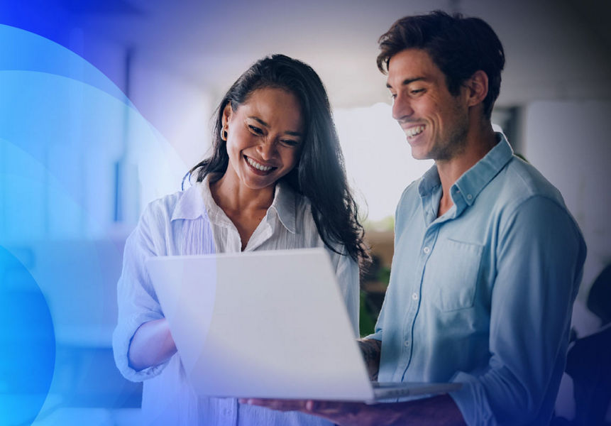 Two happy professionals woking with modernised applications on a laptop 