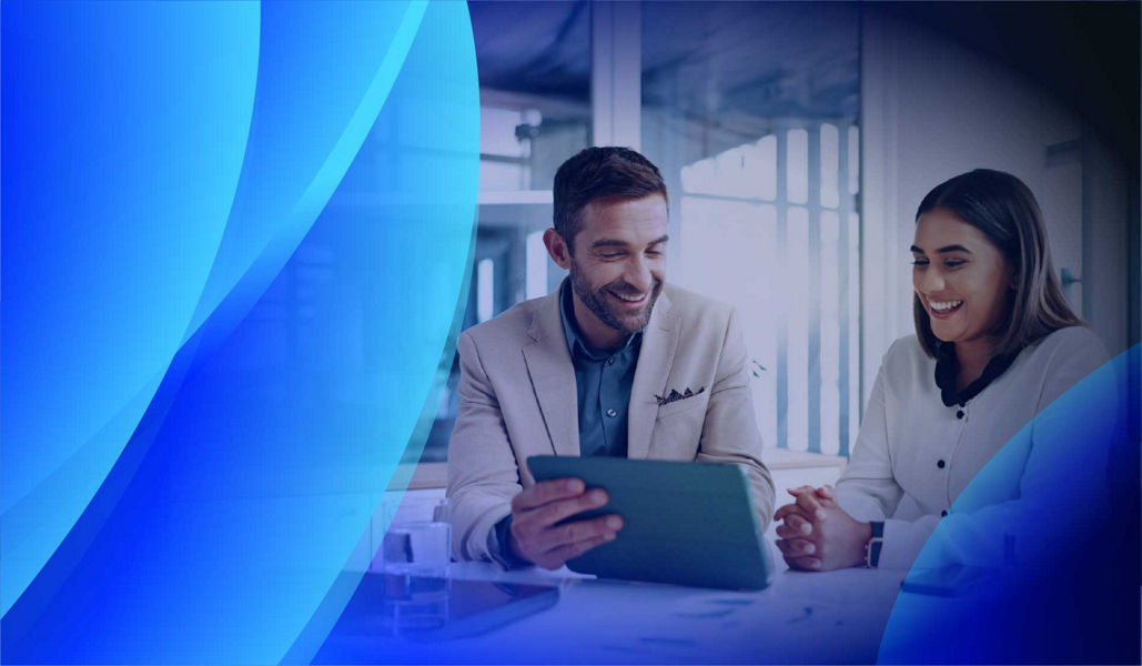 Two people having a discussion about assets while reviewing usage data