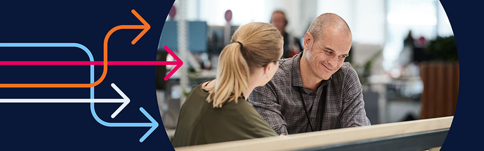 two people working together in an office