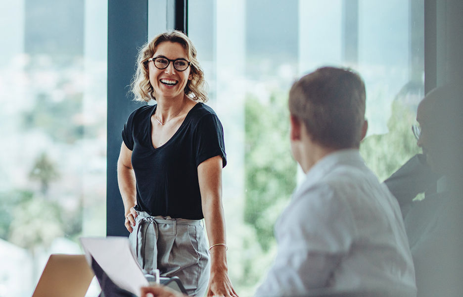 A woman and a man discussing in a office setting