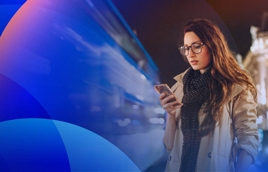 A customer checking a smartphone while walking through a fast-paced city environment