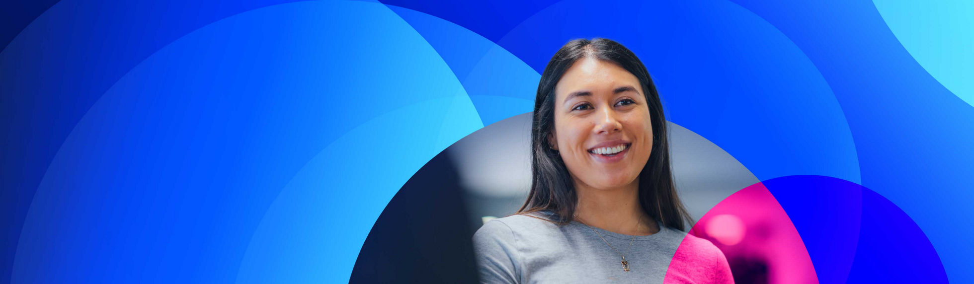 A young female smiling into camera surrounded by Datacom branding.
