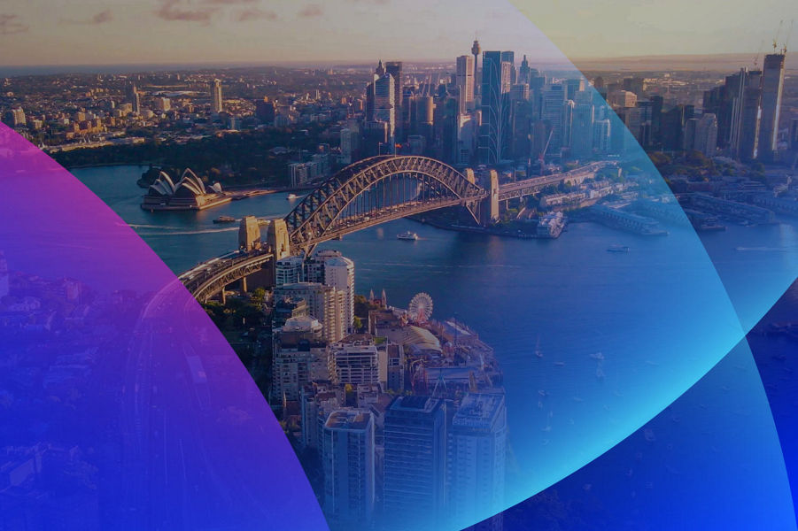Banner with blue and pink lenses across an image of Sydney city landscape from above