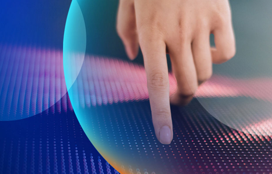A hand touching an LED tech wall