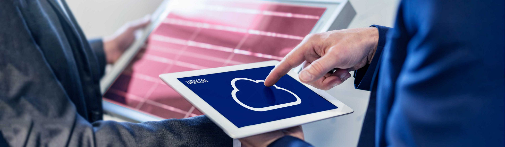 Two cloud specialists displaying information on tablets