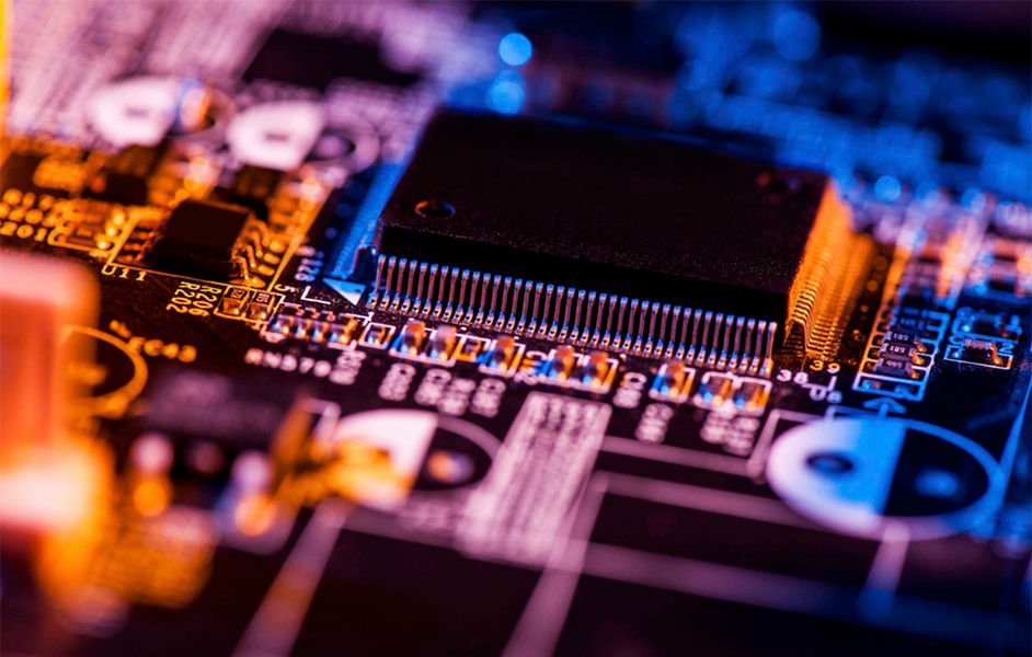 A close up shot of a circuit board with a large processing chip