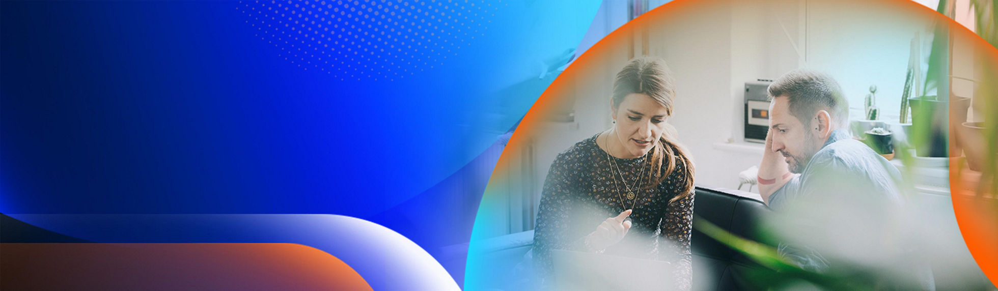 Two people having a conversation in an office with desks and indoor pot plants around them with an orange and blue lens overlay