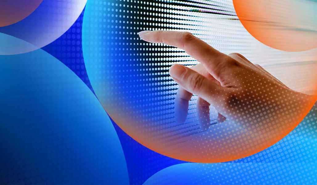 A persons hand touched a screen with a black and white pattern on it with an orange and blue lens overlay