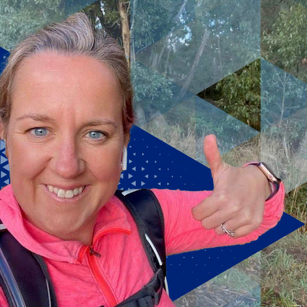 Datacom's Alex Coates holding her thumbs up