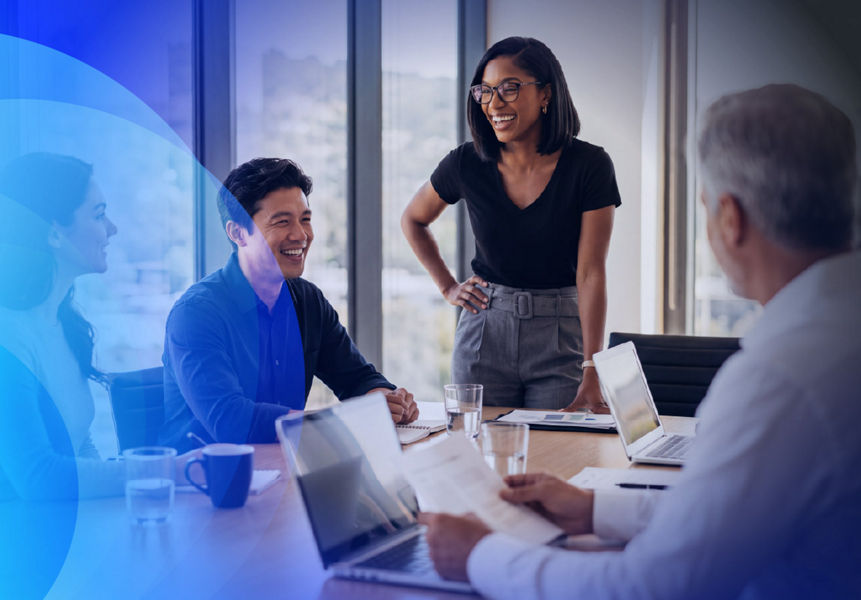 Consulting team collaborating in a meeting room, discussing strategy and solutions around a conference table.