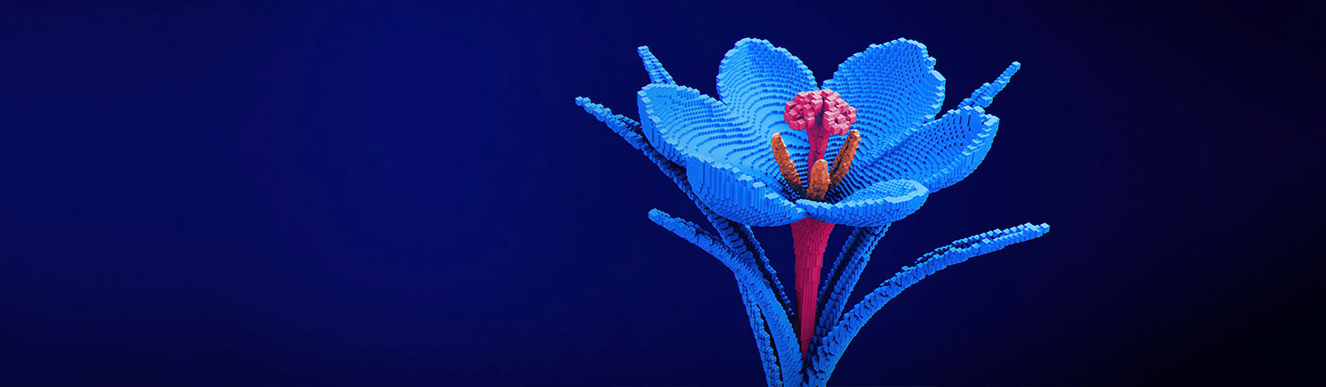 A blue digital flower with a pink stem made up of blocks