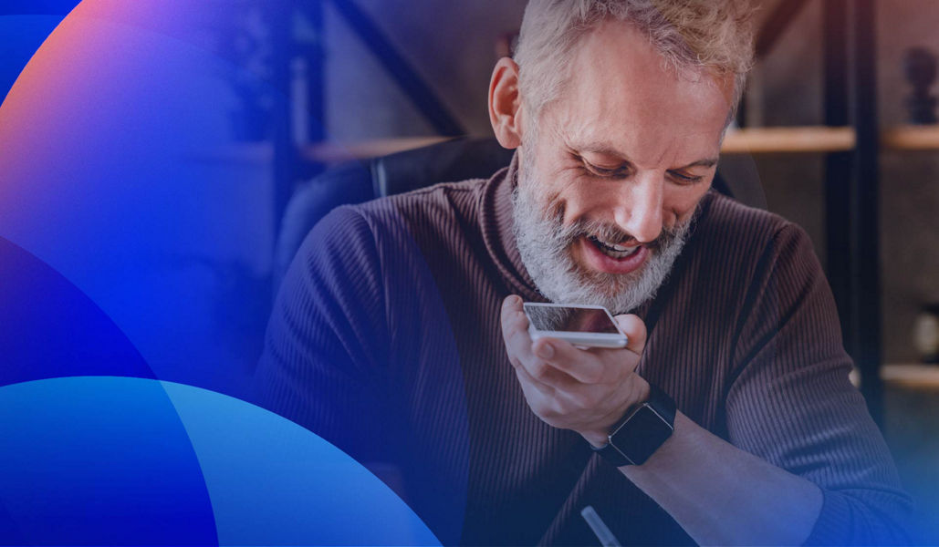 A smiling customer speaking on a smartphone.