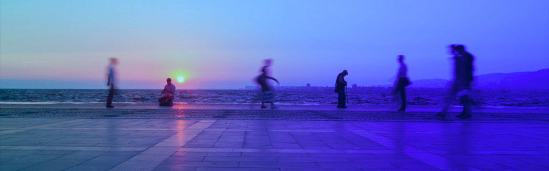 People walking on a boardwalk
