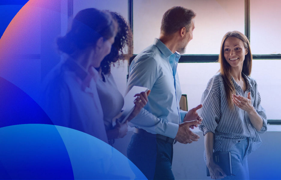 A team walking while talking in a modern office