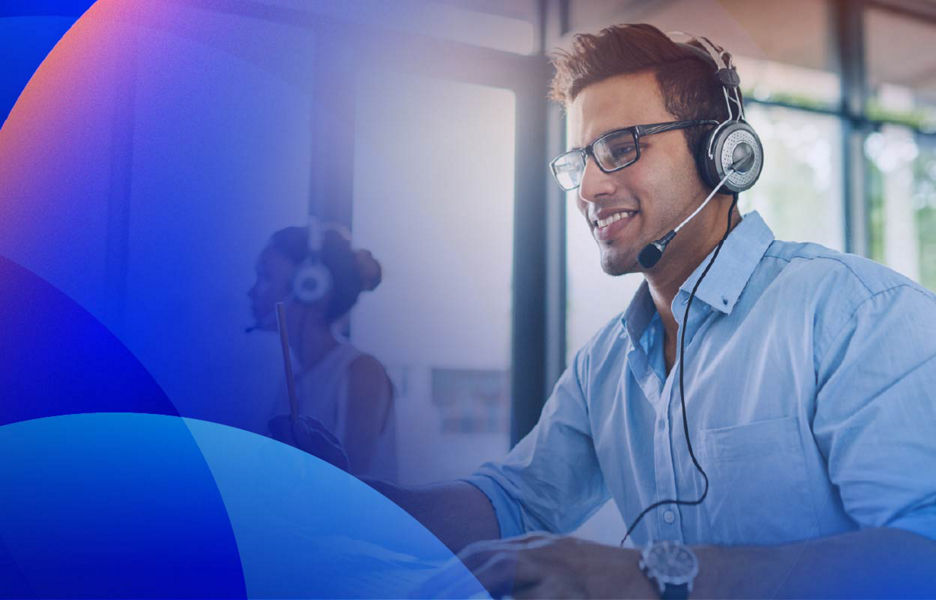 Customer service contact centre agent assisting customers in a modern office environment.