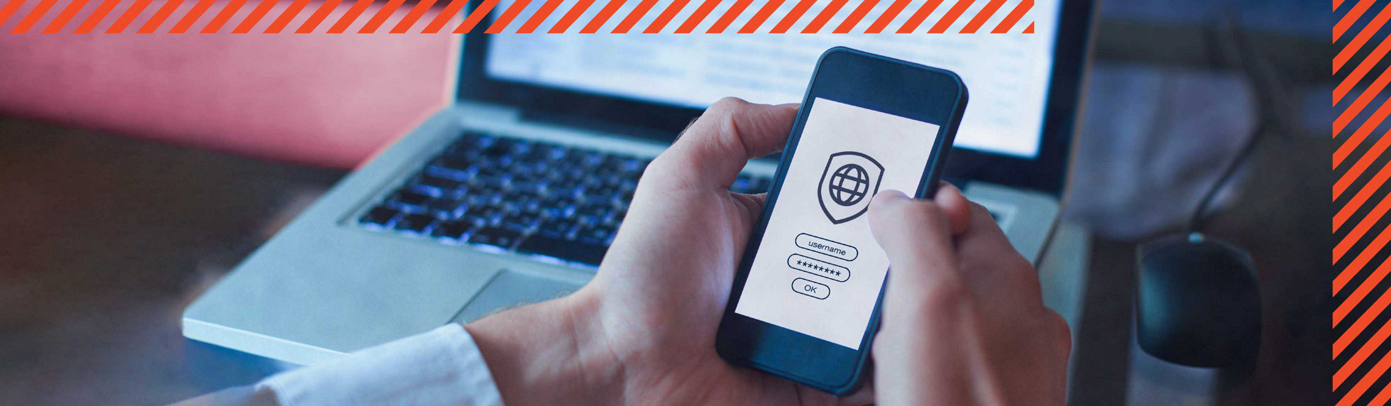 A person using a security application on a phone and laptop