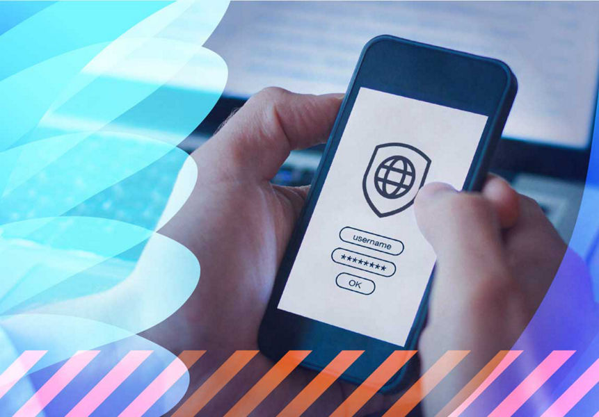 A person using a security application on a phone and laptop