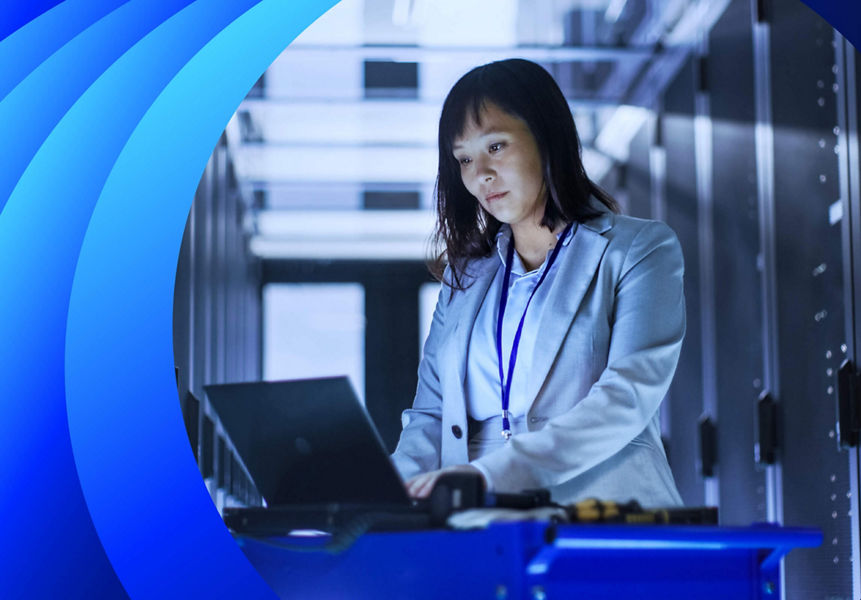 Young business woman running tests in a data centre