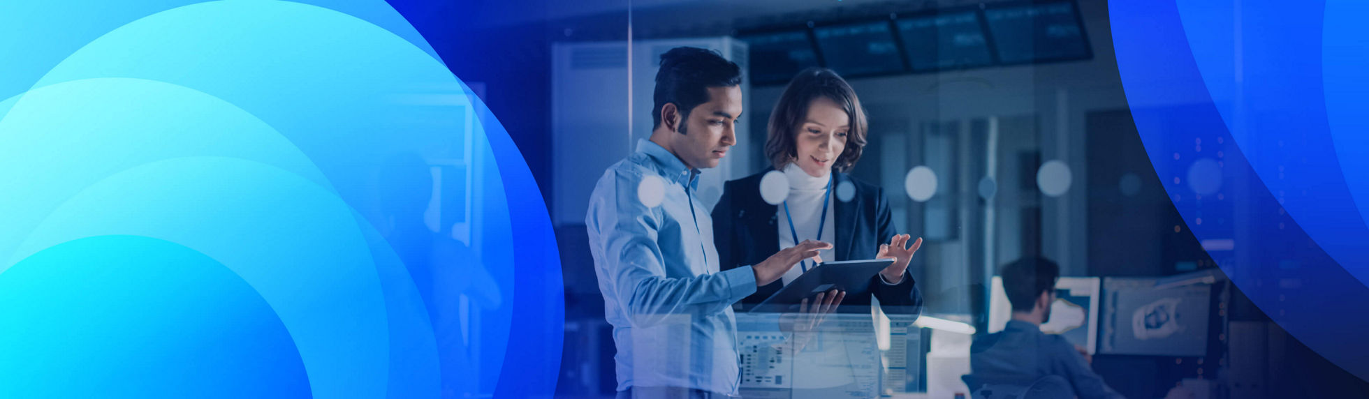 Two people using keyboards connected via cloud networking surrounded by angular geometric shapes