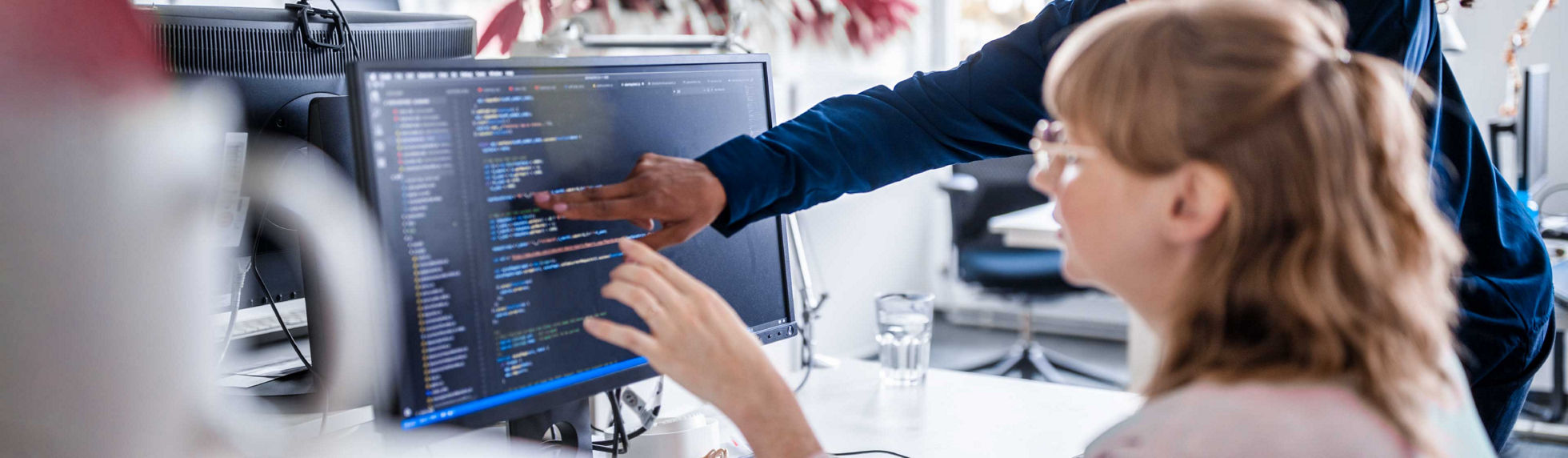Software engineer coding database configurations