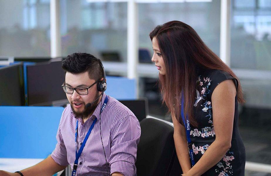 Two Datacom employees talking