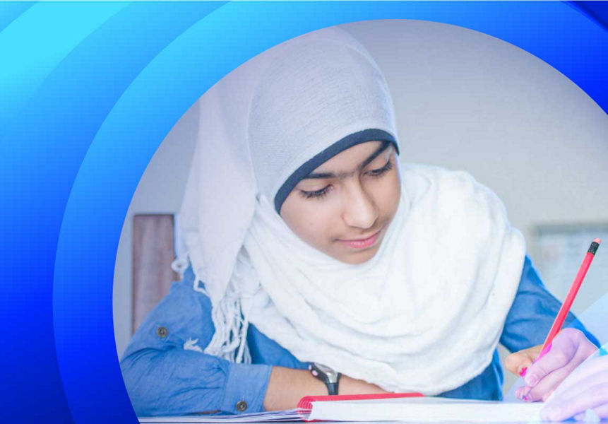 Girl with hijab writing