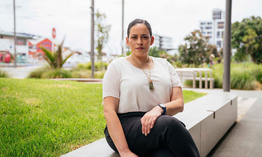 Datacom's Denise Carter-Bennett sitting on a bench