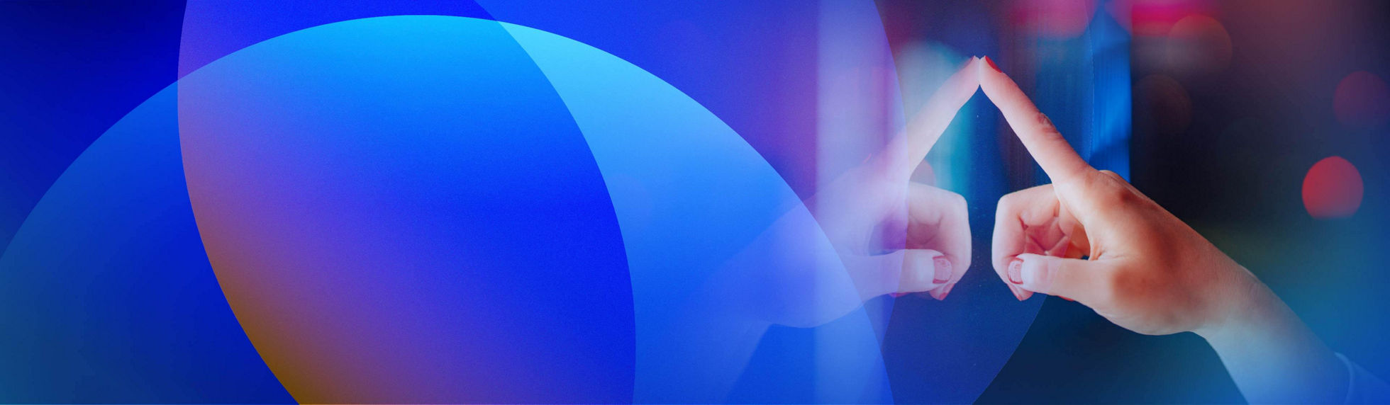 A hand interacting with a digital sign against a background of colourful blurred lights.