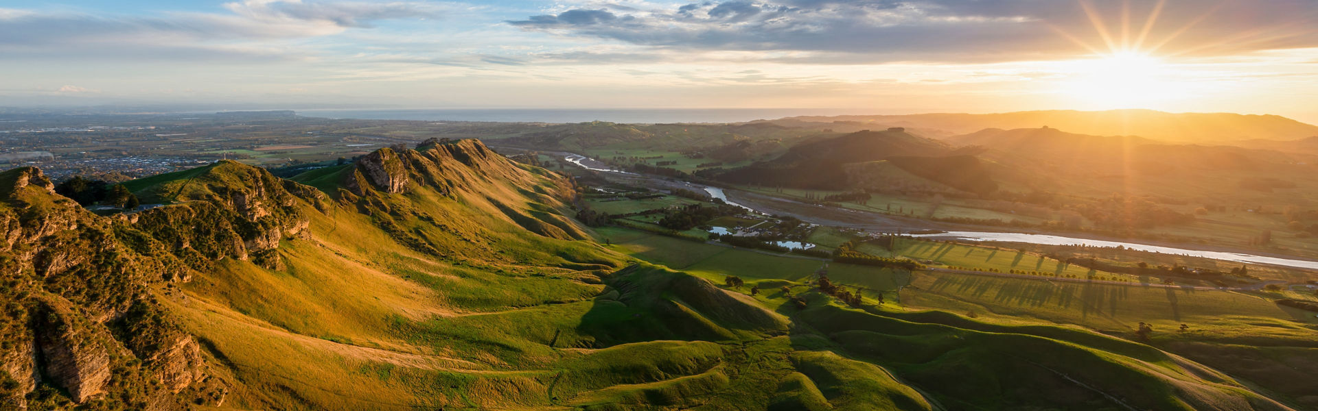 Panorama of the sun rising over Te Mata peak in Hawke's Bay New Zealand