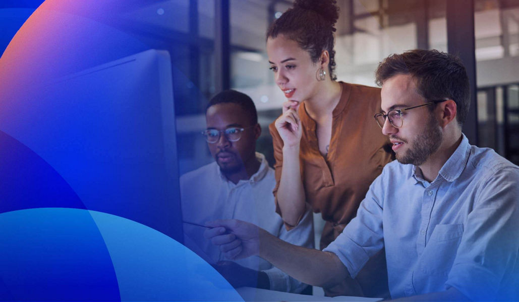 An experience team designing AI-enhanced digital experiences in front of a computer