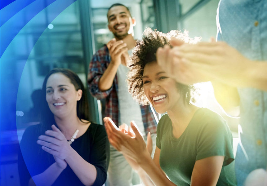 A team applauding to achievement in the boardroom