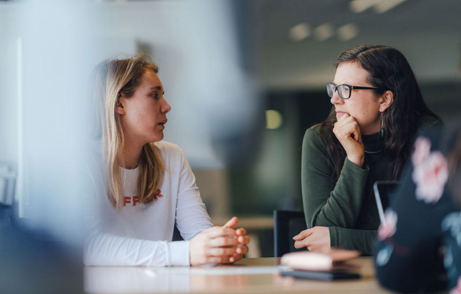 Two Datacom employees deep in discussion