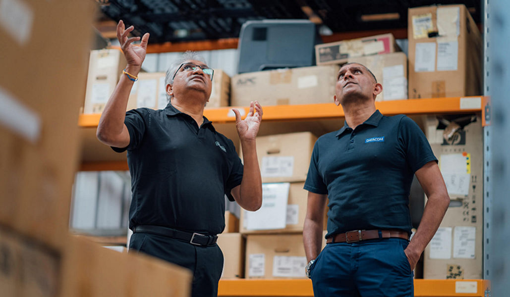 Two workers in a warehouse