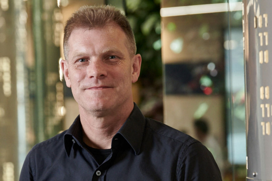 Portrait of Datacom CEO Greg Davidson, smiling at the Tahi office.