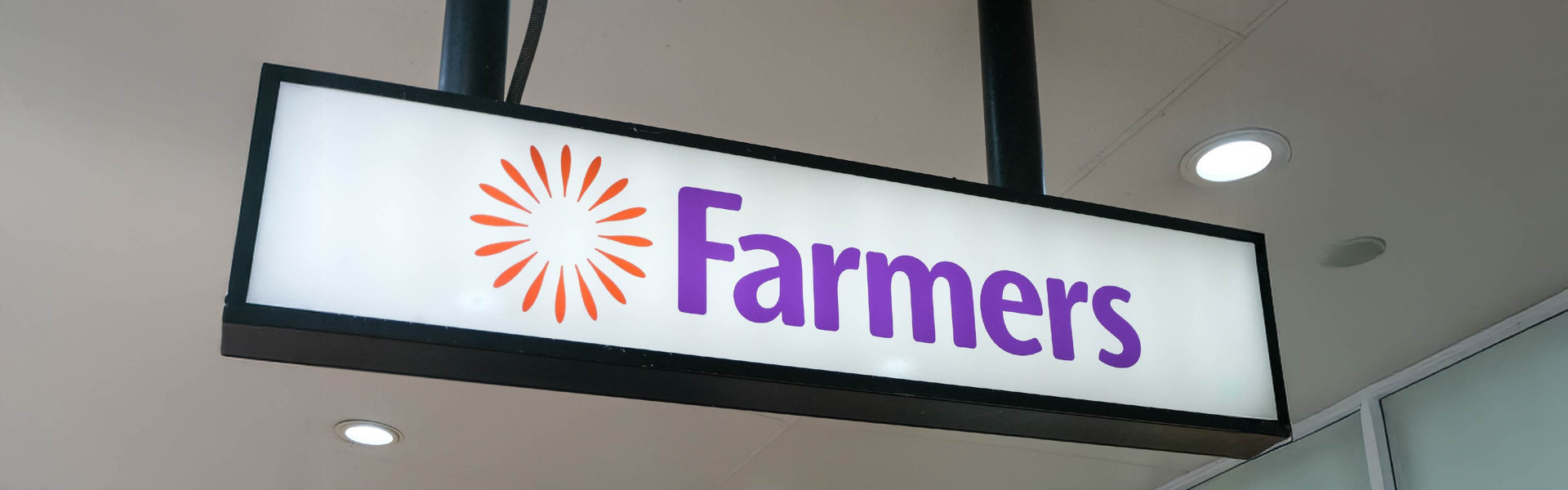 Farmers department store logo shown on the exterior of a shop.  