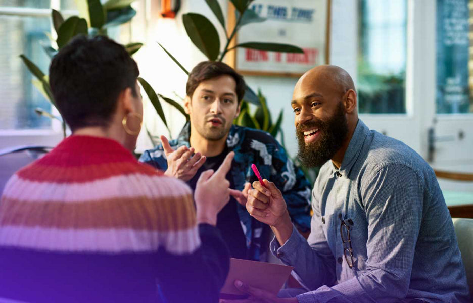 Group of people together talking and discussing ideas