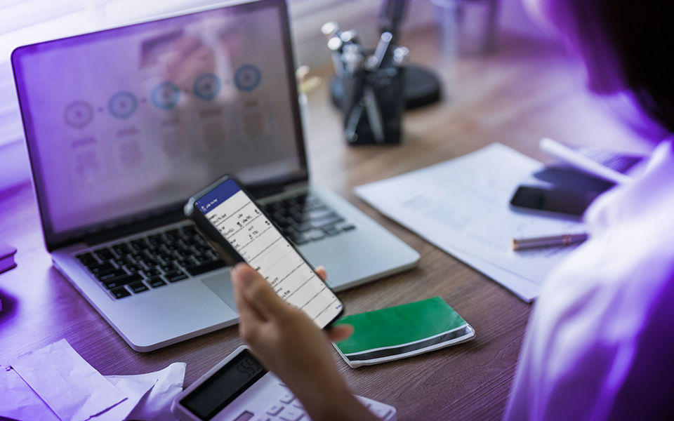A person managing their finances using Datascape on their phone