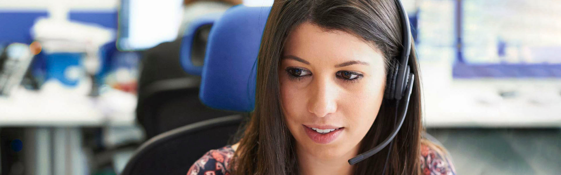 A close up shot of a female customer service representative on a call
