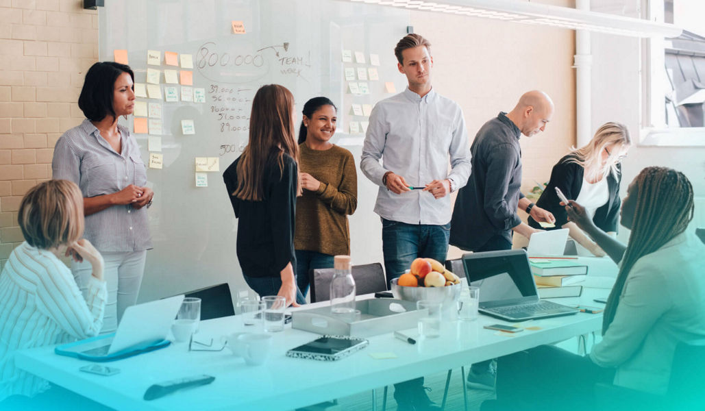 Group of people in an office during a workshop/ideation session